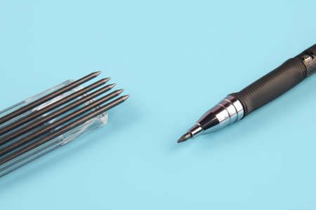 Mechanical pencil with leads on blue backgroundの写真素材