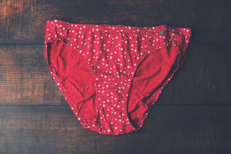Female cotton set panties on woodeb tableの写真素材