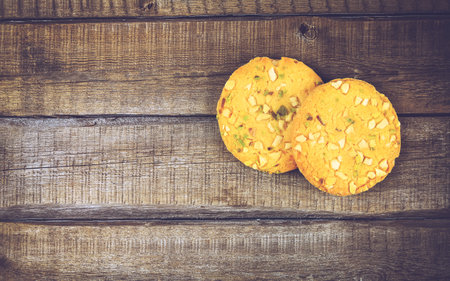 Home made sweet biscuits with mixed nuts on gray backgroundの写真素材