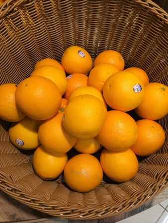 Oranges in basket at super market.の素材
