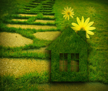 ecological house on a background of green grassの写真素材
