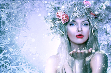 Beautiful girl in the winter image. Hoarfrost and snow on a girlの写真素材