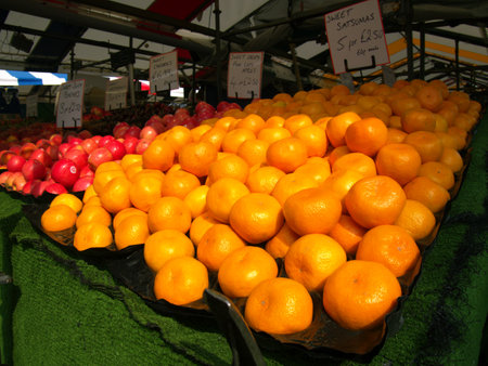 Satsumas on display at a food stallの写真素材