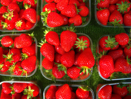 Strawberries on display at a food stall.の写真素材