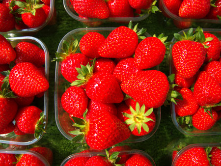 Strawberries on display at a food stall.の写真素材