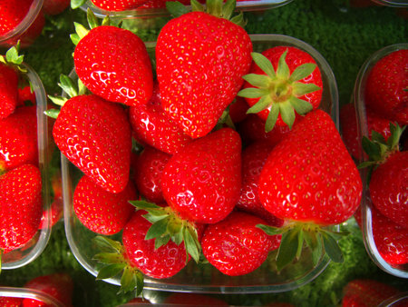 Strawberries on display at a food stall.の写真素材