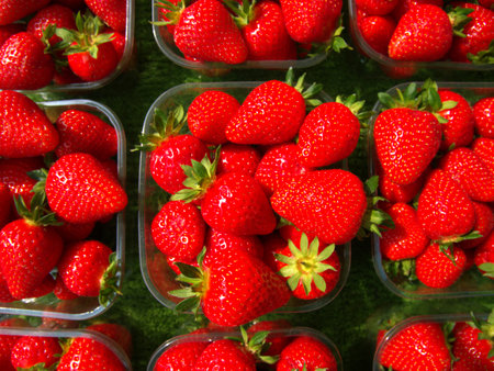 Strawberries on display at a food stall.の写真素材