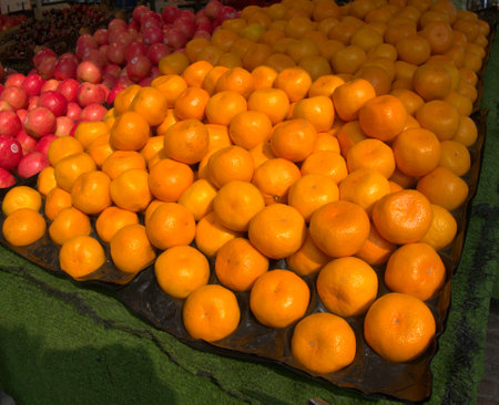 Satsumas on display at a food stallの写真素材