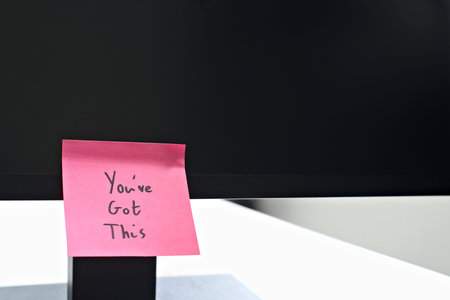 You've Got This sticky note left on a monitor. The bright note stands out against the monitor,...