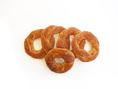 Five bagels with sesame isolated on white 