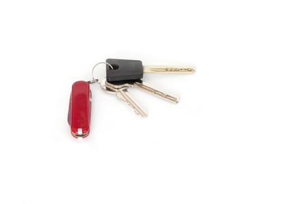 Keys with penknife isolated on white backgroundの写真素材
