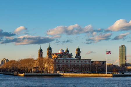 Ellis island from side view in open cloudy sky.のeditorial素材