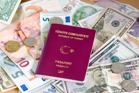 Turkish passport on euros, dollars and turkish moneyの写真素材