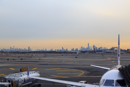 At newark airport, newark, NJ - December 31, 2016: United airlines airplane in the newark airport with new york silhoutteのeditorial素材
