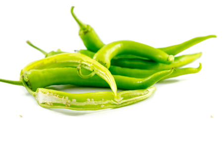 Small green peppers on white backgroundの写真素材
