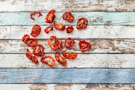 Sun-dried tomatoes on vintage tableの写真素材