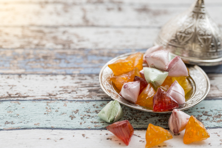 Akide (sugar) candies on old metallic plate on vintage tableの写真素材