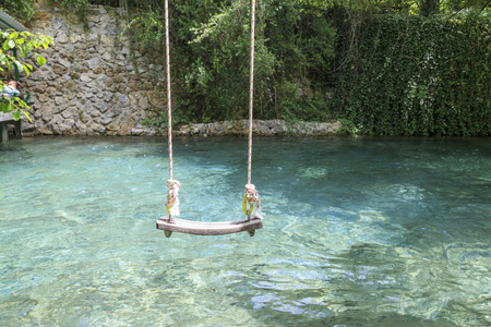 Single swing over the creek of yuvarlakcay near koycegiz in mugla, Turkeyの写真素材