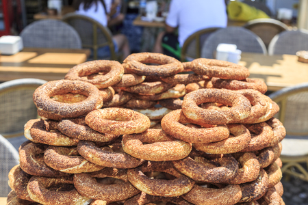 Pile of simits (turkish bagels) on street during daytime.の写真素材
