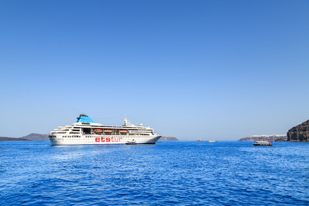 Santorini, Greece - July 6, 2018 : ETS tur cruise ship on the bay of sea near port of Fira, Santorini island, Greeceのeditorial素材
