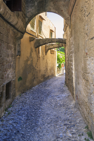 Historical street of old town Rhodes with archs in Rhodes, Dodecanese, Greeceの写真素材