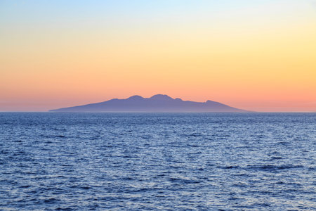 Entire Symi island view from distance during sunset in aegean sea near Symi, Dodecanese, Greeceの写真素材