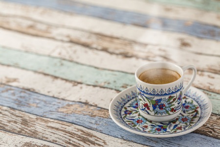 Hot turkish coffee on turquoise table side viewの写真素材