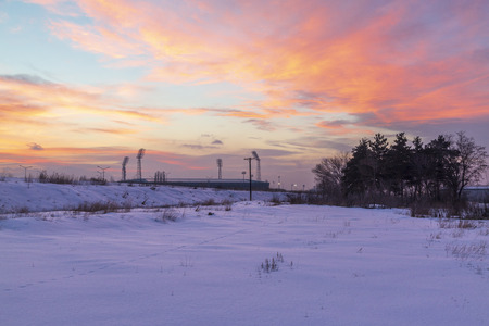 Beautiful pink sunset over Kazim karabekir stadium with snow in Erzurum, Turkeyの写真素材