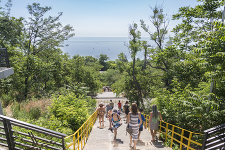 At stairs to 15 Fontana beach of Odessa, Ukraine - June 8, 2019: People walking to the beach 15 Fontana in Odessa, Ukraineのeditorial素材