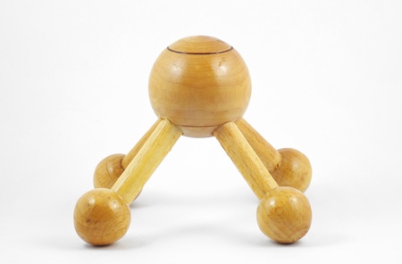 Wooden massage tool isolated on a white background の写真素材
