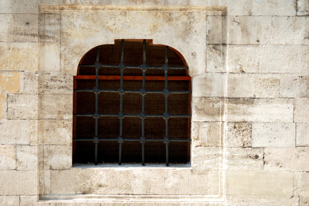 Old stone wall and window with lattice