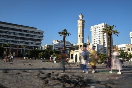 06/27/2020, Konak, Izmir, Turkey, Visitors and children who feed birds in Izmir clock towerの写真素材