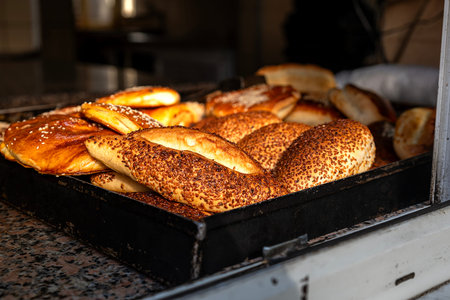 delicious buns with sesame seeds and poppy seeds in the ovenの写真素材