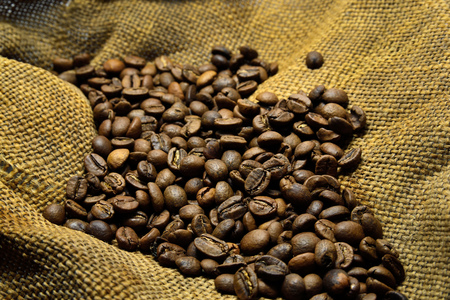 Coffee beans on the background of old sackingの写真素材