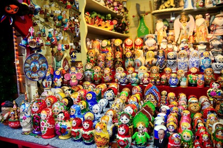 Colorful close up details of christmas fair market. Wooden matrioshka decorations for sales. Russian dollsのeditorial素材