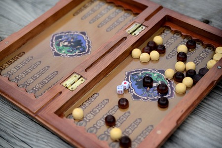 Color detail of a Backgammon game with two dice close up.のeditorial素材