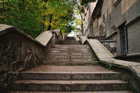 Old concrete stairs leading up to the cityの写真素材