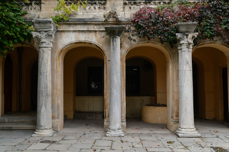 Three ancient columns on the facade of the building, the decor in the ancient styleの写真素材