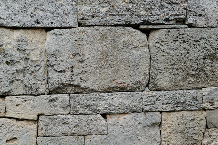 Fragment of an ancient wall with masonryの写真素材