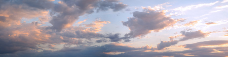 Colorful panorama of beautiful juicy sunset cloudsの写真素材