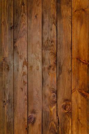 dark vintage wooden background of pine-covered boards varnishedの写真素材