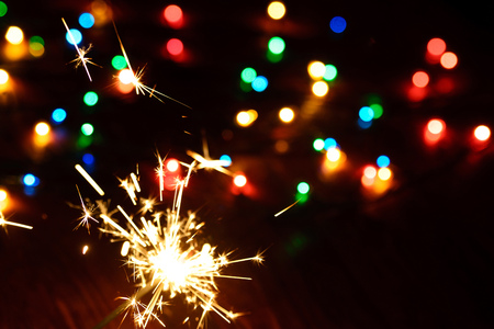 Abstract New Year background, Bengal lights and blurry colored lightsの写真素材