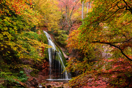 The picturesque Jur-Jur waterfall in the autumn forestの写真素材