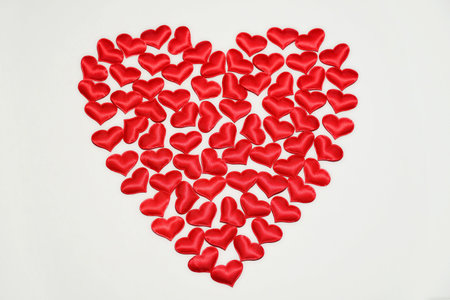 Red decorative hearts on a white background, concept love
