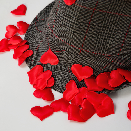Red decorative hearts scattered on the hat, concept loveの写真素材