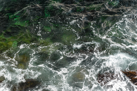 Storm on the sea, foam and waves, top view, abstract patternの写真素材