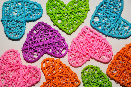 Multicolored decorative hearts on a white background, concept loveの写真素材