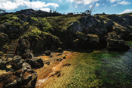 rocky seashore on a sunny summer dayの写真素材