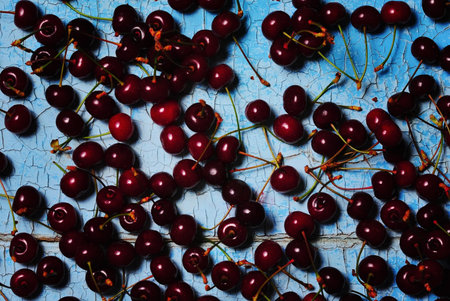 Ripe juicy red cherry rustic on a blue background