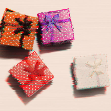 Four color gift boxes in glitch effect on a white background